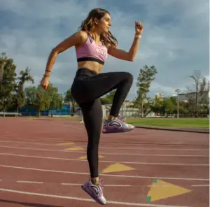 A girl at an athletics track warming up